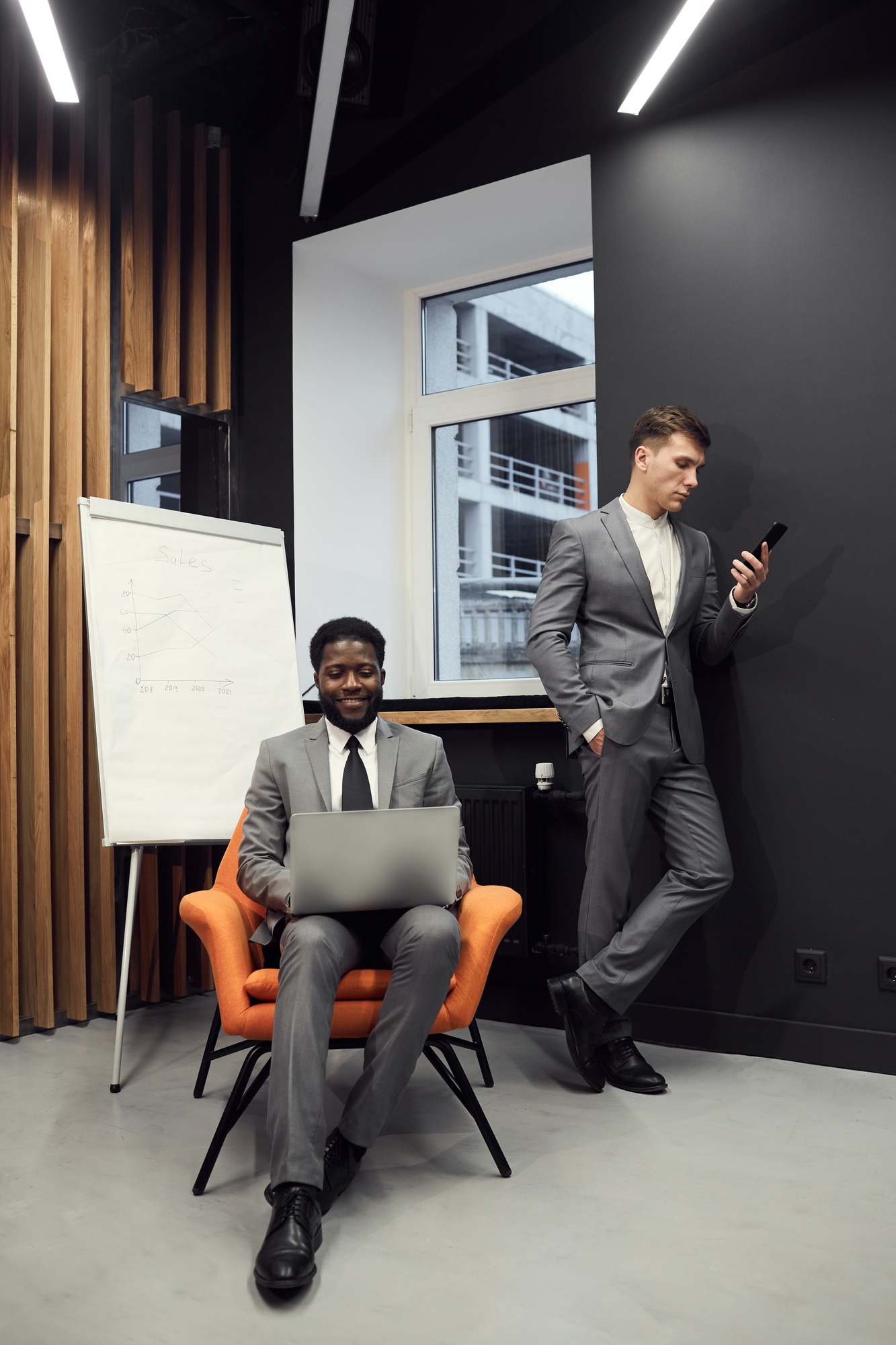 Young successful managers working with social medias